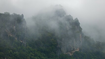 misty on dramatic high mountains. Beautiful landscape after the rain in the morning.