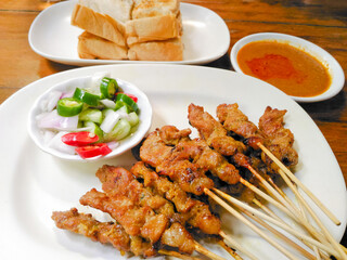 Beef satay with cucumber salad and peanut sauce