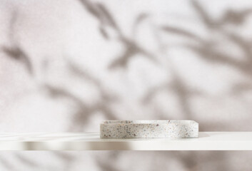 Beauty cosmetics product presentation mockup scene made with white stone tray on white shelf in elegant minimal interior. Studio photography.