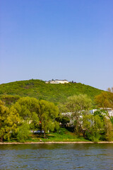 Distant view of luxury hotel on Petersberg from Rhine river in Königswinter, Germany