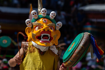 A colorful mask dance and drum beating being performed at Hemis Monastery at Leh, Ladakh India.