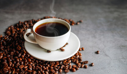 Coffee cup and coffee beans on  gray background, Black coffee cup aromatic