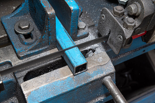 Metal cutting Horizontal Band Saw, part way through cut. Metal saw.