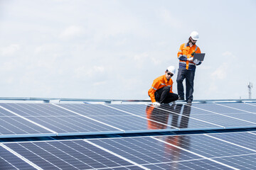 Professional Engineer Service Solar Panel. Worker Maintenance Cleaning Replacing Solar Panel. Solar photovoltaic panel system in Industry roof. Saving Energy with Clean Power.