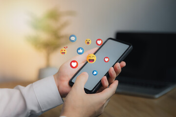 Social media and digital online concept, man using smart phone with Social media. The concept of living on vacation and playing social media. Social Distancing ,Working From Home concept.