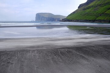 Tjørnuvík beach with Risin and Kellingin sea stacks on horizon. Island of Streymoy, Faroe Islands, Denmark. 