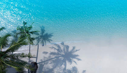 Obraz premium Aerial view of travel with summertime as palm tree and Tropical white sand beach blue of seashore background