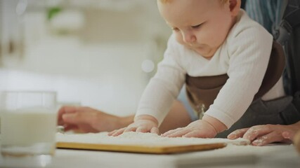 Nutrition. A caring parent prepares food with a child in a modern kitchen. A woman of European appearance sifts flour while preparing breakfast with a child, advanced parenting methods, comfortable