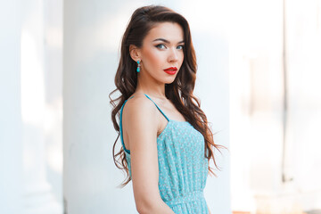 Chic beautiful young woman model with vintage dress on white background on the street