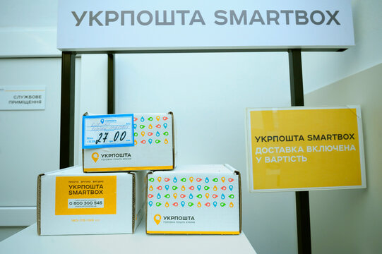 Post office. Parcels in boxes placed on a table, service SmartBox advance payment for postage by the state enterprise Ukrposhta. Kyiv, Ukraine