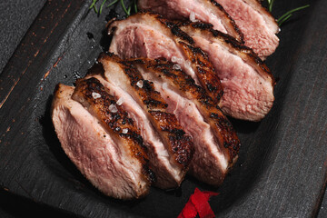 Fried duck breast with fresh orange and ginger, ready to eat food. Domestic cuisine, poultry meat