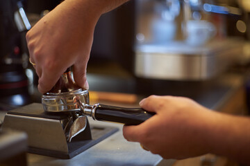 Barista preparing coffee in a coffee shop