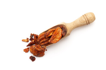 Top view of a wooden scoop filled with Organic Stone Apple or Bel (Aegle marmelos) fruit. Isolated on a white background.