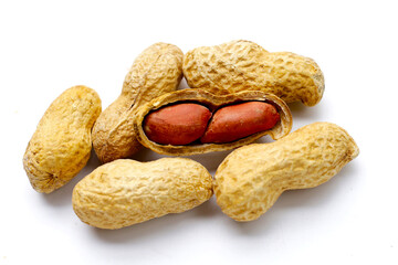 Roasted peanuts in shell on white background.