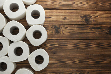 Lots of toilet paper rolls on wooden boards. Top view