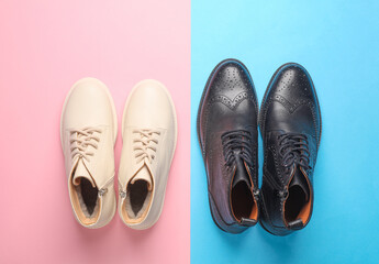 Male and female shoes on a blue-pink background. Top view