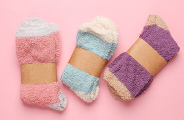 New socks with wrapped tags on pink background