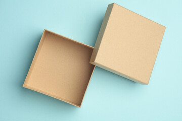 Kraft cardboard box on blue background