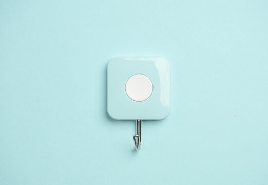 Hook hanger for kitchen or bathroom on blue background