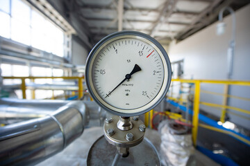Gas equipment. Industrial premises with gas pipes. Gas compressor station fragment. Pipes with pressure sensors.