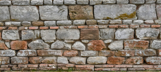 Fototapeta premium Ancient Stonewall A Weathered Brick Texture Pattern. Generative AI.