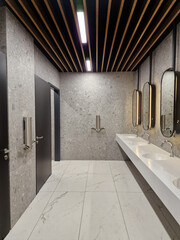 interior of public restroom with modern hand dryer