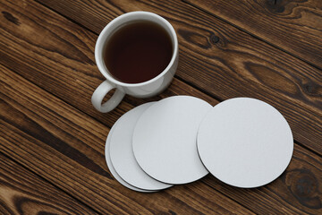 White round empty coasters Mockup and coffee cup on wooden background