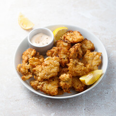 Traditional homemade chicken nuggets with sauce