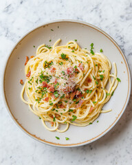  spaghetti carbonara with parmesan and bacon, on white marble background, food photography top down view