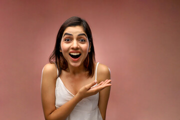 Fototapeta premium A Beautiful Woman Is Laughing While Standing In Front Of The Camera