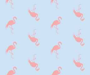 Różowe flamingi. Wzór bezszwowy. Sylwetki ptaków na niebieskim tle. © Monika