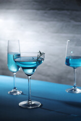 Glasses with blue alcohol cocktail ready for a party
