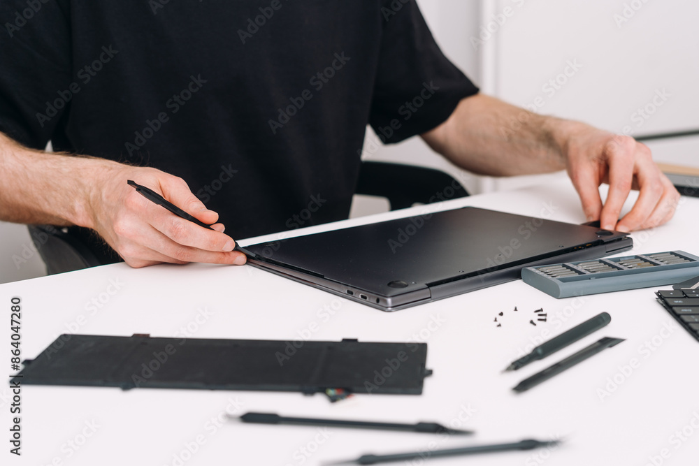 Poster man replace old battery on pc computer or digital tablet