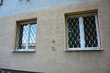 Obraz premium Barred windows of an apartment block