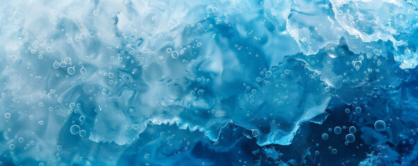 Obraz premium Ice background depicting a frozen lake with cracks and bubbles trapped within the ice. The colors range from deep, cold blues to clear whites, enhancing the natural beauty of the frozen water.