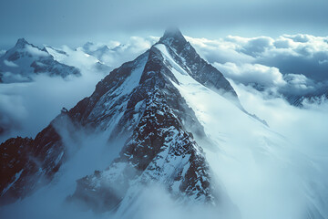 Majestic Snow-Capped Mountain Peak in the Clouds