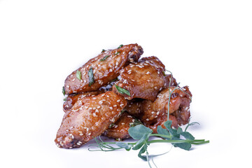Isolated fried chicken wings with sweet sauce on white background
