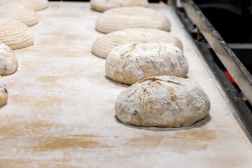 dough on the board prepare for baking in an industrail oven.  