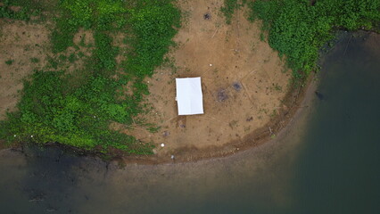 Aerial view of fishing tent in dam Thailand.