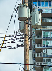 Power transformers mounted on wooden pole