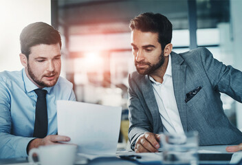 Business meeting, documents and men in office with budget review, savings or sales profit, revenue and report. Economy, accounting or investor team with information, planning or inflation solution