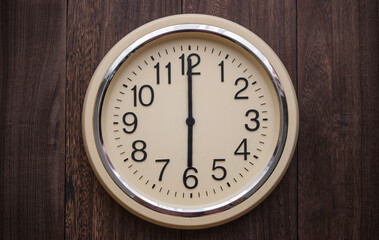 Wall clock showing 6 o'clock sharp. 18:00 . 6:00. Six o'clock