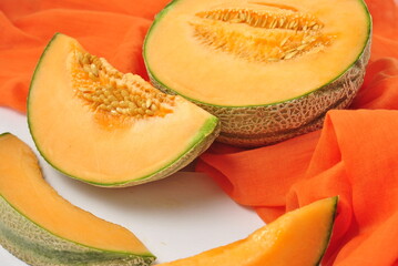 orange melon on a green background