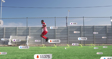 Image of multiple notification bars over biracial soccer player doing jumping drill before match
