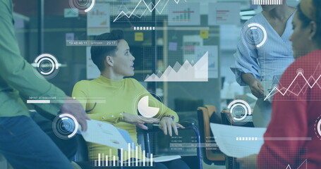 Image of multiple graphs, loading bars, circles, diverse coworkers discussing reports in office