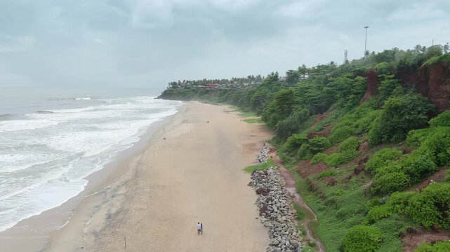 Shoreline of Varkala Cliff Beach, drone view of Varkala beach from the top of the cliff also known as Papanasham Beach, Thiruvananthapuram, Kerala, India