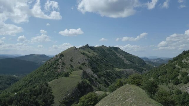 Soar above the majestic Italian mountains with this stunning drone footage. Enjoy breathtaking views of rugged peaks, lush valleys, and pristine natural beauty from a bird's-eye perspective. Nerone