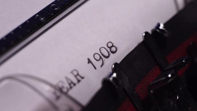 Year 1908, Typing on Blank White Paper in Vintage Typewriter, Close Up