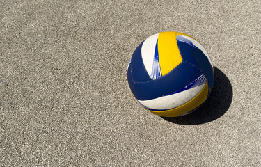 volleyball ball with blurred arena in background.