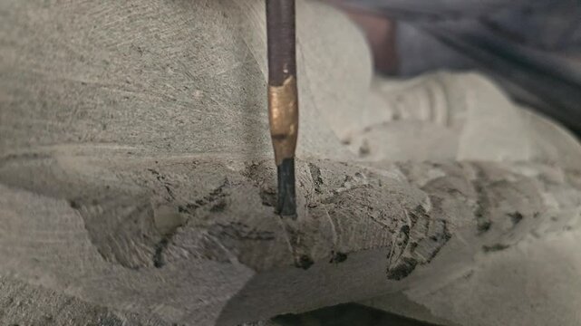 Sculptor Carving On stone. Working with stone and sculpting statue. Extreme Closeup